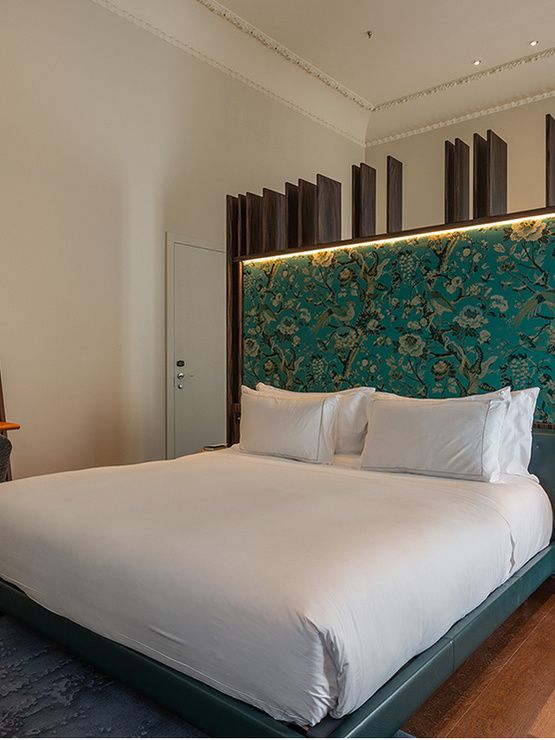 Bed of suite bedroom in Hotel Mercer Sevilla