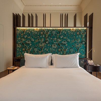 Double bed in the suite room of the Mercer Sevilla Hotel