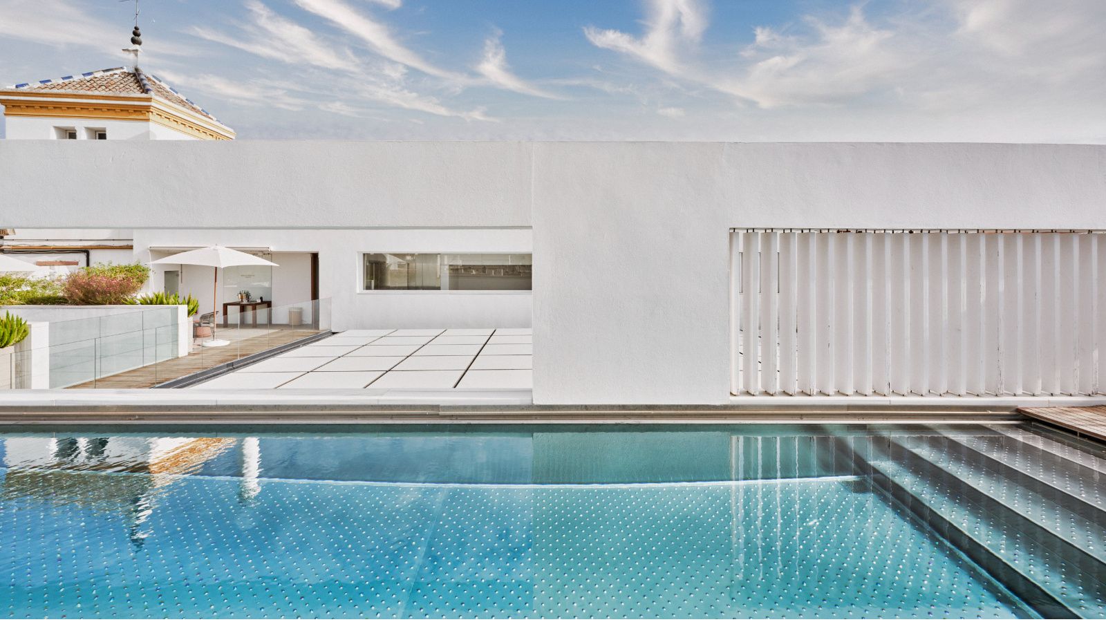 Outdoor rooftop terrace with swimming pool at the Hotel Mercer Sevilla